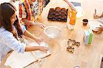 Children making dough in kitchen