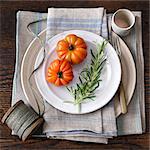 Tomatoes, rosemary, plate, kitchen towel, string