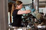 Female brewer working in brewhouse