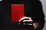 Man holding red card