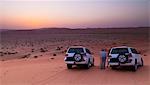 Four wheel drive vehicles in the desert; Liwa Oasis, Abu Dhabi, United Arab Emirates