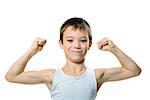 boy showing his biceps muscles strength isolated on white background