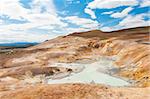 Leirhnjukur is the hot geothermal pool at Krafla area, Iceland. The area around the lake is multicolored and cracked.