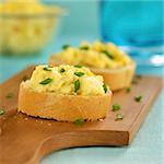 Scrambled eggs and green onion on baguette