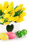 Easter eggs with spring yellow flowers. Isolated on white background