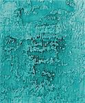 Turquoise and Grey Damaged Obsolete Cement Wall Background closeup