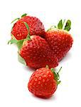 Four Perfect Ripe Strawberries isolated on white background. Focus on Foreground