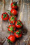 Arrangement of Perfect Ripe Cherry Tomatoes on Rustic Wooden background