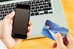 Man using smartphone for online shopping in close up