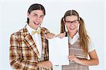 Geeky hipsters holding a poster on white background