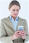 Businesswoman using her mobile phone on white background