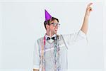 Geeky hipster pointing something on white background