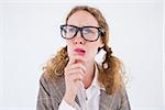 Geeky hipster woman thinking with hand on chin on white background