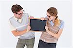 Geeky hipster couple holding little blackboard on white background