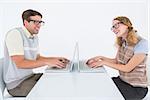 Geeky hipster couple using laptop on white background