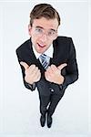 Geeky businessman with thumbs up on white background