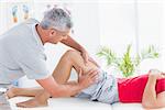 Man having thigh massage in medical office