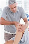 Man having knee massage in medical office