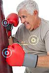 Portrait of a determined senior boxer against fitness interface