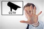 Businessman with hand out against cctv