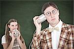 Geeky hipsters using string phone  against green chalkboard