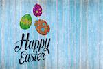 happy easter against wooden planks