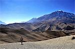 Trekker in Mustang. Ghami. Nepal.