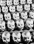 1950s ROWS OF BABY DOLL HEADS IN PRODUCTION LINE