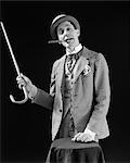 1910s 1920s CHARACTER CON MAN BARKER BOWLER HAT LOUD VAUDEVILLE TYPE CLOTHES POINTING CANE SMOKING CIGAR CONFIDENCE GAME