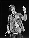 1910s 1920s CHARACTER CON MAN BARKER BOWLER HAT LOUD VAUDEVILLE TYPE CLOTHES HOLDING CANE SMOKING CIGAR CONFIDENCE GAME