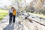 Husband and wife taking walk, Hahn Park, Los Angeles, California, USA