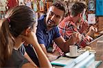 Couples chatting at restaurant bar