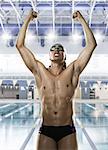 Male swimmer punching the air