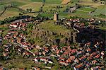 France, Haute-Loire (43), Polignac village arranged in a circle around a basaltic rock terrain topped with an old castle,