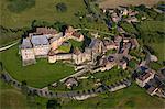 France, Dordogne (24), Biron village dominated by the castle twelfth century listed historical monument (aerial view)