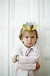 Little boy with a paper crown on the head