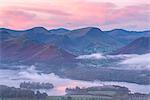 Misty autumn sunrise over Derwent Water and the Newlands Valley, Lake District National Park, Cumbria, England, United Kingdom, Europe