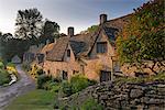 Picturesque cottages at Arlington Row in the Cotswolds village of Bibury, Gloucestershire, England, United Kingdom, Europe
