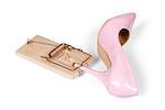 Single pink women's heel shoe with mousetrap isolated over white with clipping path.