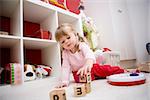 Baby girl playing in her room