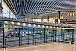 HONG KONG, S.A.R., CHINA - JENUARY 29, 2014: Passengers in the airport main lobby on Jenuary 29, 2014 in Hong Kong, China. The Hong Kong airport handles more than 70 million passengers per year.