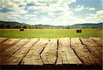 Wooden empty table. Wooden display with spring fields bokeh.