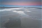 low tide on North sea and sunrise, Schiermonnikoog, Holland
