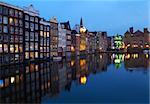Famous Buildings on canal in Amsterdam, Netherlands
