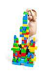 Toddler boy is playing with building blocks