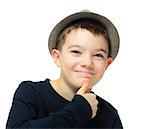 Boy clothing a hat with hand on his chin on white background