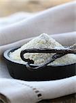 vanilla sugar with natural stick in a wooden bowl