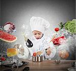 Little child chef playing and having fun