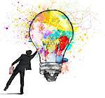 Businessman color with a spray a lightbulb