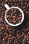 Coffee is a brewed drink with a distinct aroma and flavor, prepared from roasted coffee beans, the seeds found inside "berries" of the Coffee plant